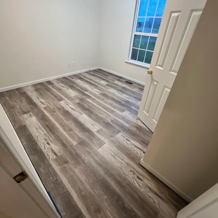 Flooring installation in a bedroom by ALV Floors Team